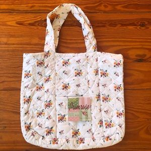 Two’sCompany quilted tote bag. White with pink and yellow floral print.